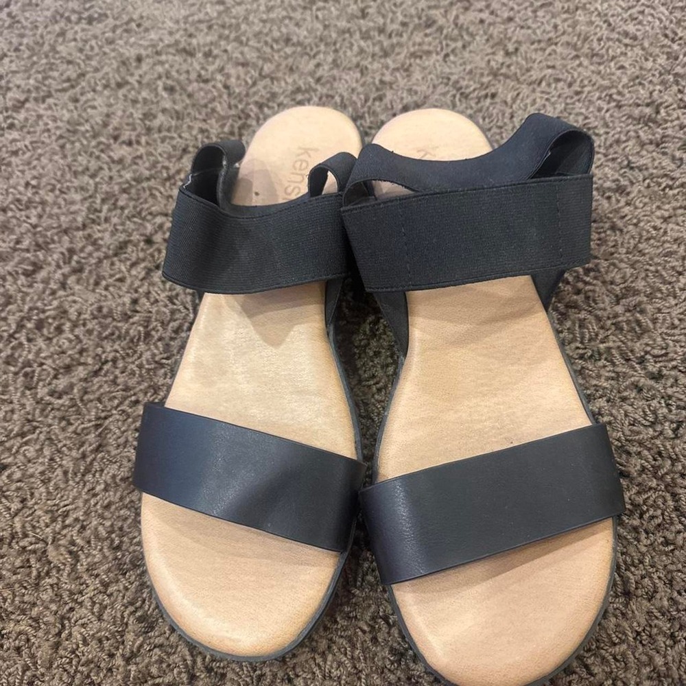 black leather sandals with elastic straps
